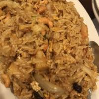 Pineapple Fried Rice · Choice of meat stir-fried with rice, pineapple, egg, onions, green onions, cashews, and rais...
