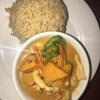 Panang Curry · Pumpkin, bell peppers, and carrots in sweet and creamy peanut red curry sauce and coconut mi...