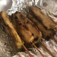 5 Chicken Satay · Grilled chicken breast (on the stick) marinated in coconut milk and spices, served with pean...