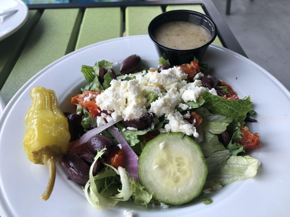 Greek Salad · Mixed greens, Kalamata olives, cucumbers, tomatoes, red onions, pepperoncini and feta cheese. Vegetarian.