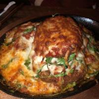 Eggplant Lasagna · Hand breaded, layered with house marinara, 3 cheese blend and arugula. Served with a salad.