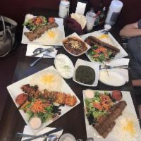 Gheymeh Bademjan · Chunks of beef, split peas, fried onions and eggplant.