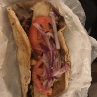 Gyro · Grilled pita with sliced seasoned pork, tomatoes, red onions, fries and our own house made t...