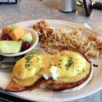 Eggs Benedict · 2 poached eggs and Canadian bacon on an English muffin smothered with hollandaise sauce and ...