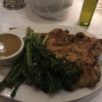 Brick Chicken · Mostly de-boned, pan seared, rosemary garlic cream sauce over roasted potatoes and broccolin...