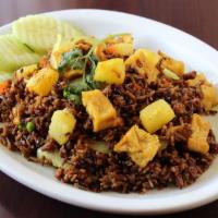 Pineapple Fried Rice · Wild rice stir fried in curry powder with pineapple, cashew nuts, tofu, onion, peas, carrots...