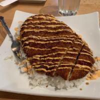 Chicken Katsu · Breaded chicken cutlet served over a
bed of steamed rice and coleslaw on
the side, drizzled ...