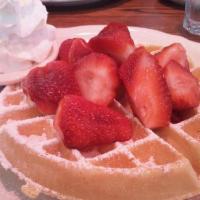Fresh Strawberry Patch Waffle · Waffle dusted with powdered sugar topped with fresh strawberries, and real whipped cream. Se...