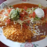 Super Burrito · Soft flour tortilla filled with rice, beans, cheese, beef or chicken, covered with Spanish s...