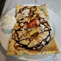 Banana Nutella Crepe · Fresh banana with nutella sauce topped with powdered sugar ＆ chocolate drizzle.