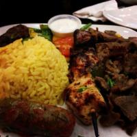 Mediterranean Cruise Dinner · Skewer of chicken and beef, gyros, kufta, grape leaves with rice and grilled vegetables.