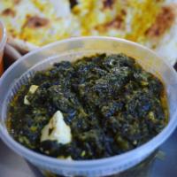 Palak Paneer · Paneer (Cheese Cubes) Cooked with Traditionally Prepared Spinach consisting of Ginger, Garli...