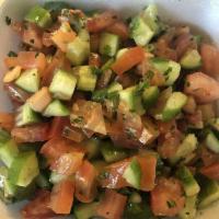 Lebanese Salad · Chopped cucumber, tomato mixed with olive oil, lemon juice.