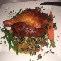 Crispy Duck · Served with wild rice, haricots vert, carrots and a fusion of orange and grand mariner.