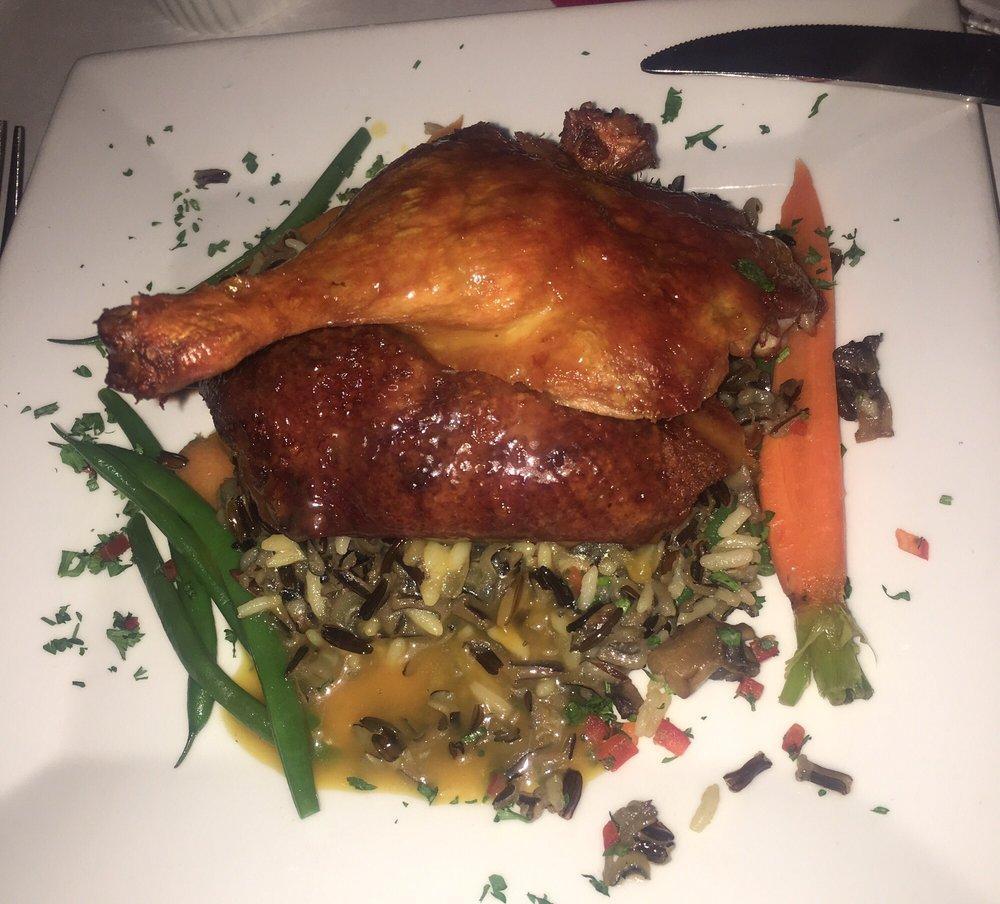Crispy Duck · Served with wild rice, haricots vert, carrots and a fusion of orange and grand mariner.