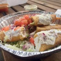 Flautas · 3 Crispy rolled corn tortillas stuffed with your choice of chicken or  cut in half. This com...