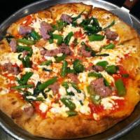 Broccoli Rabe Pizza · Served with tomato, garlic, fennel sausage and chili.
