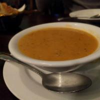 Red Lentil Soup · Slow-cooked lentils pureed with vegetables and herbs.