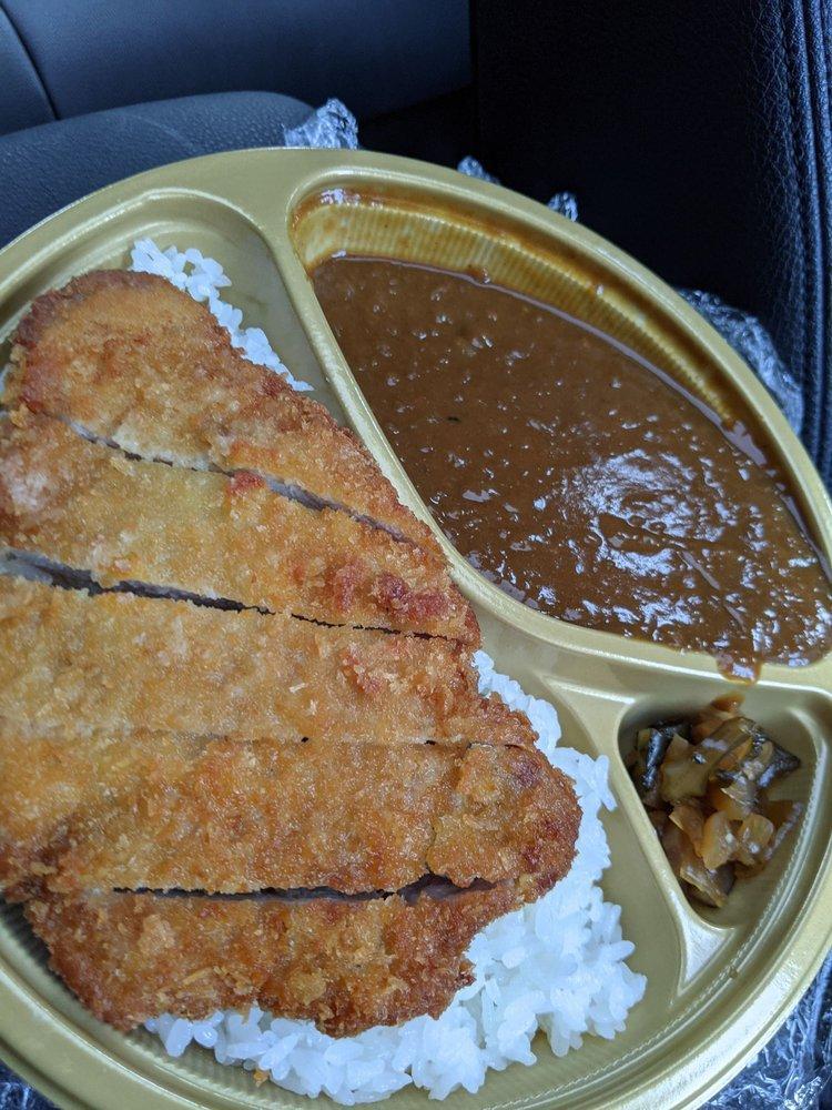 Katsu Curry Rice · Pork or chicken cutlet over rice with our house curry and Japanese relish on the side