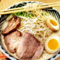 Tonkotsu Ramen · Egg noodle in a rich pork broth with tender braised pork, soft boiled egg, scallions, and be...