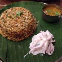 Kothu Parotta · Famous Southern style flaky bread, shredded and stir fried.
