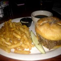 Beef on Weck Sandwich · Slow cooked beef round on a weck roll topped with caraway seeds and kosher salt served with ...