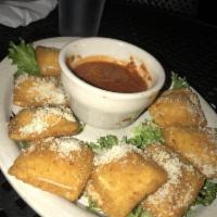 Toasted Ravioli · Stuffed with mozzarella cheese served with homemade marinara topped with Parmesan.