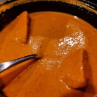 Butter Chicken · Tandoori chunks of chicken cooked in an exquisite creamy tomato sauce. Served with basmati r...