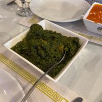 Lamb Saag · Tender lamb pieces cooked with chopped spinach, onion, ginger, garlic and spices with a touc...