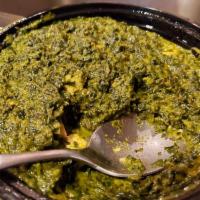 Palak Paneer · Fresh homemade cheese cooked in a creamy spinach sauce. Served with basmati rice.