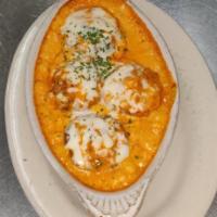 Stuffed Mushrooms · Crabmeat, minced clams, roasted peppers in a pink sauce and topped with mozzarella.