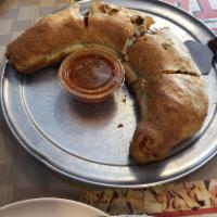 Stromboli · Cheese-filled pizza roll with pepperoni and sausage. 