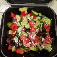Greek Salad · Cucumbers, tomatoes, onions, Kalamata olives and feta cheese, served with balsamic vinegar-l...