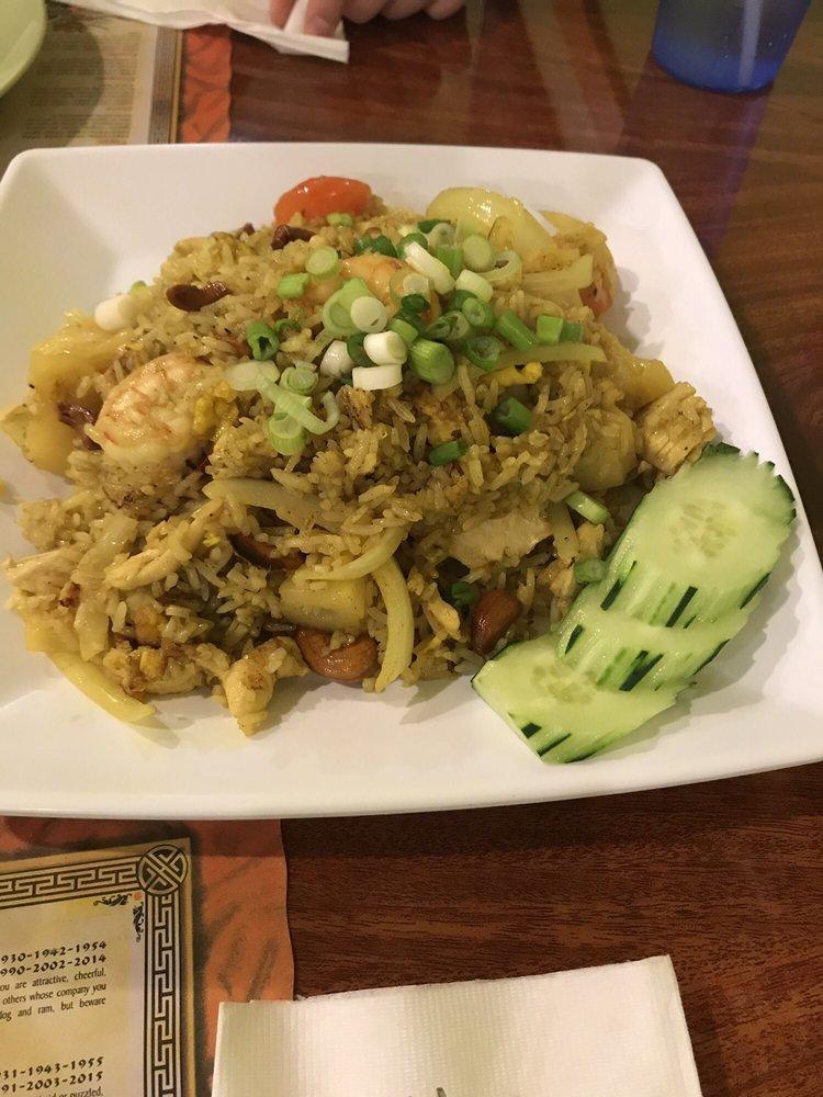 Pineapple Fried Rice · Rice with shrimp, chicken, tomato, cashew nut, egg, pineapple, raisin, onion with yellow curry powder.