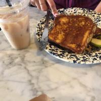 French Toast · Fresh brioche bread soaked in our vanilla custard served with green apple, a chunk of Vermon...