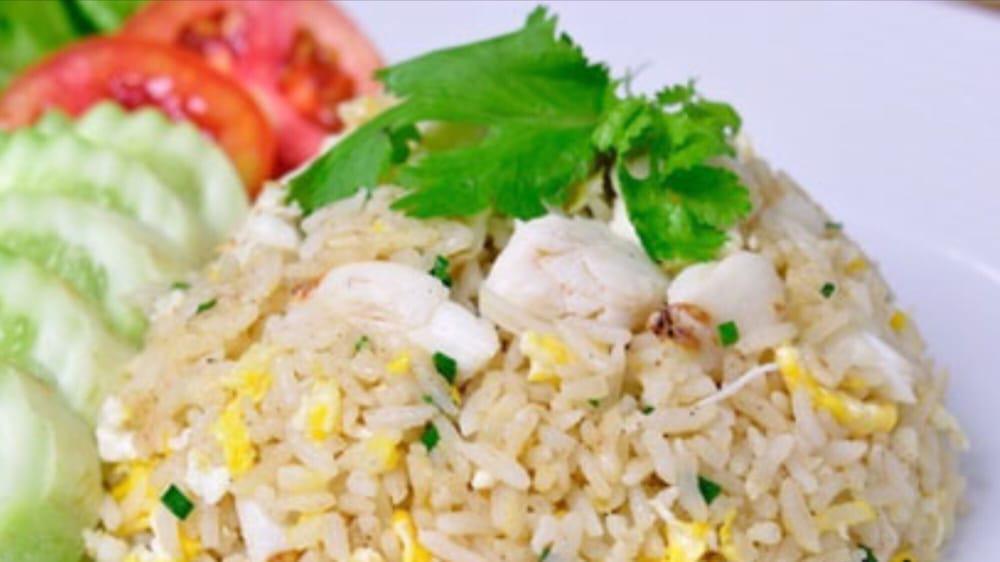 Crab Meat Fried Rice · Stir-fried rice with egg, scallion and onion. 