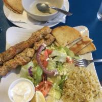Chicken Souvlaki Plate · 2 skewers of marinated and grilled chicken  served with rice or fries, pita and small Atheni...