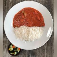 Chicken Tikka Masala · Chunks of roasted marinated chicken in a creamy spiced sauce. Served with rice.