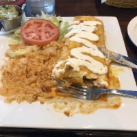 Fajita Burrito · Steak or chicken grilled with onions and bell peppers, fajita style. Topped with a special b...