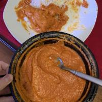 Butter Chicken · Marinated   Chicken cooked in creamy onion and tomato gravy