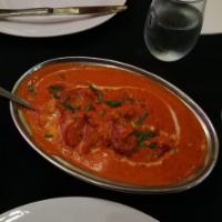 Butter Chicken · Boneless leg quarter chicken with tomato based rich creamy sauce and Indian spices.