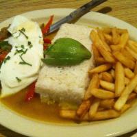 Churrasco · Top round sauteed steak with onions, peppers and tomatoes served with a side of rice, fried ...