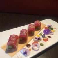 Zink Roll · Spicy crunchy tuna, avocado and yellowtail wrapped with soybean paper with fresh tuna on top.