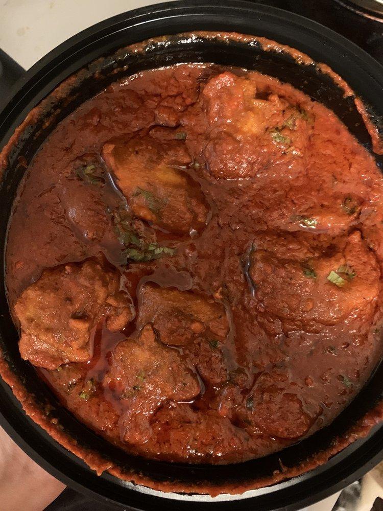 Chicken Vindaloo · Famous chicken preparation from Goa cooked with vinegar, hot chilis and spices.
