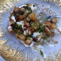Aloo Papri Chaat · Wheat crisps, chickpeas and potatoes topped with yogurt, roasted cumin, mint and tamarind sa...