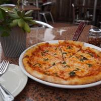 Margherita Pizza · Tomato sauce, mozzarella cheese and fresh basil.
