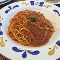 Spaghetti Della Nonna · Spaghetti, choice of one: hand rolled meat ball, Italian sausage or bolognese sauce, fresh b...