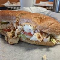 Buffalo Chicken Sub · Marinated chicken, Buffalo sauce, pepper jack, lettuce, tomatoes and your choice of blue che...
