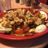 Chicken Cobb Salad · Mixed greens, bacon, avocado, tomatoes, cucumber and hard-boiled egg.