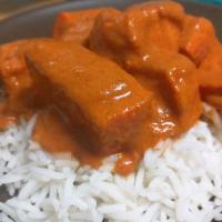 Chicken Tikka Masala · Tender chicken breast meat cooked in a tangy sauce of tomatoes, herbs and butter. Served wit...